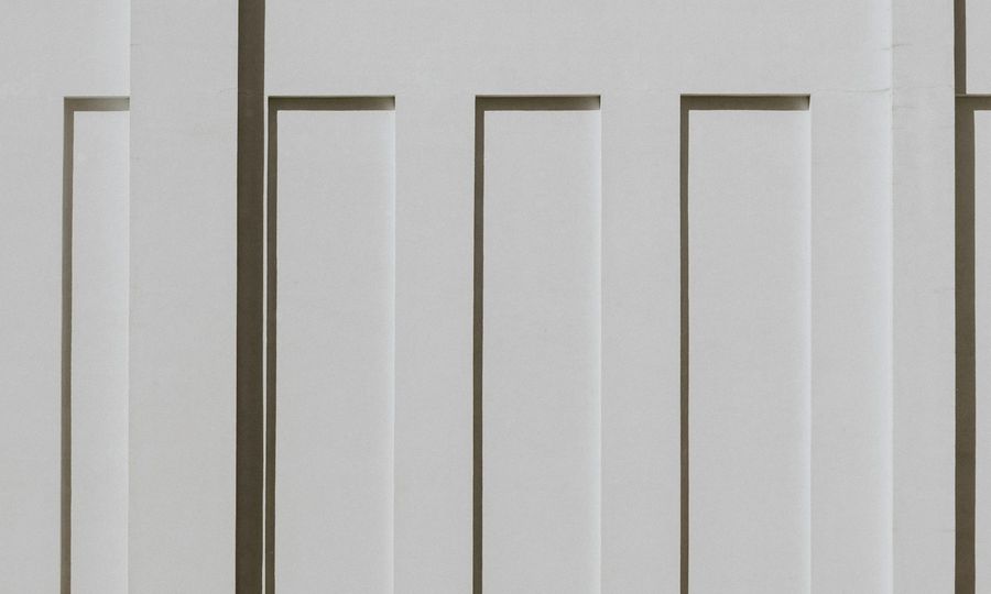 White vertical panels with strong shadows