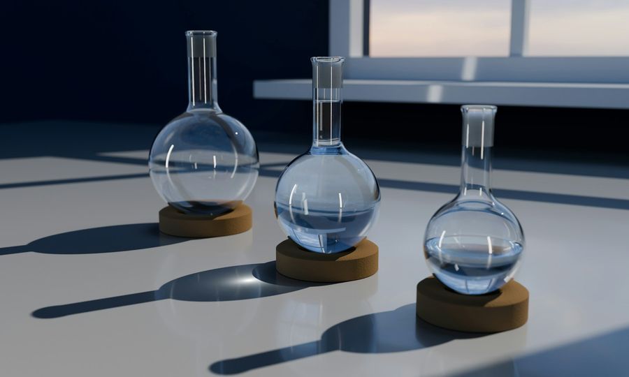 A 3D render of three glass round-bottom flasks on cork stands on a white surface