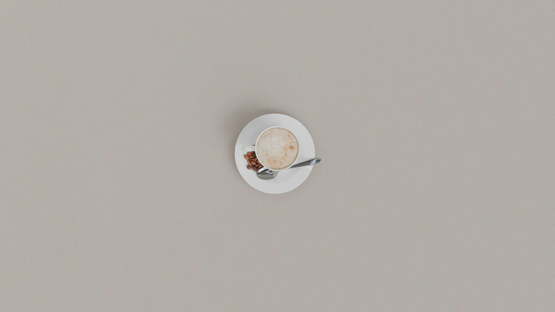 A cup of coffee with cinnamon on a saucer