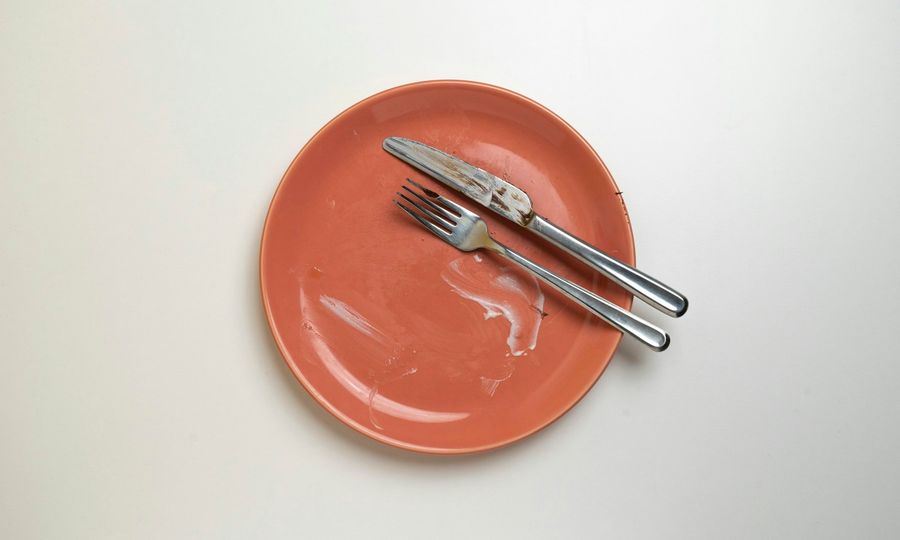A plate with a fork and knife on it