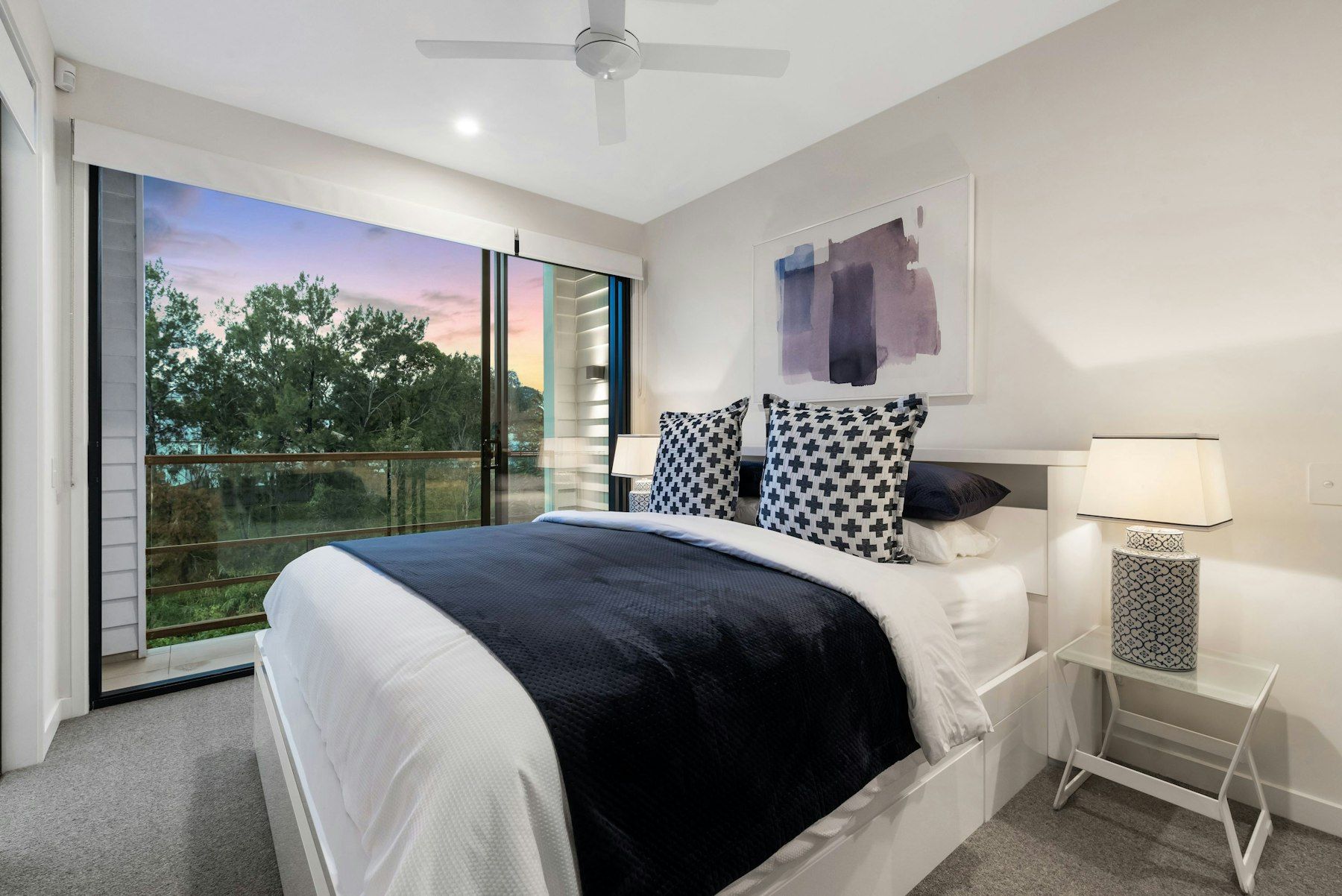 White bed with blue bed linen