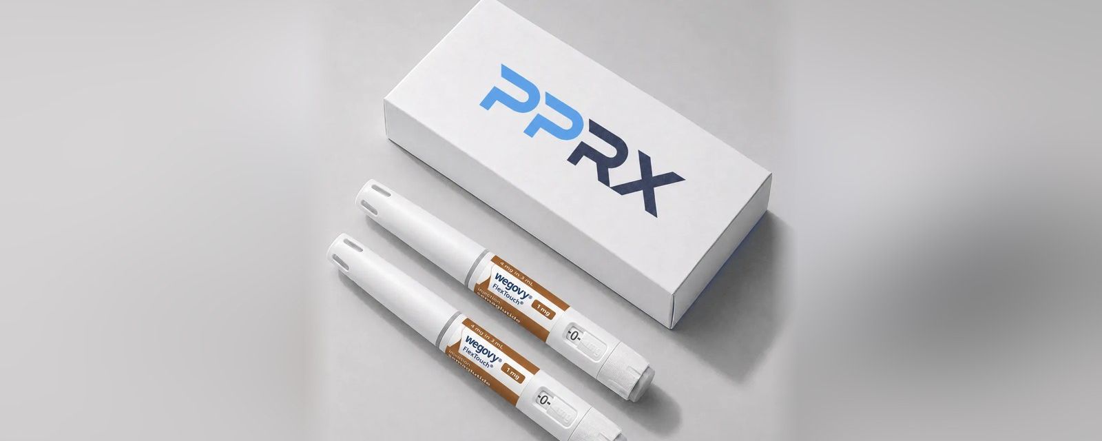 PPRX box with two Wegovy 1mg pens on a grey studio background