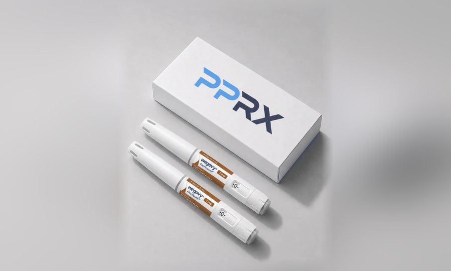 PPRX box with two Wegovy 1mg pens on a grey studio background