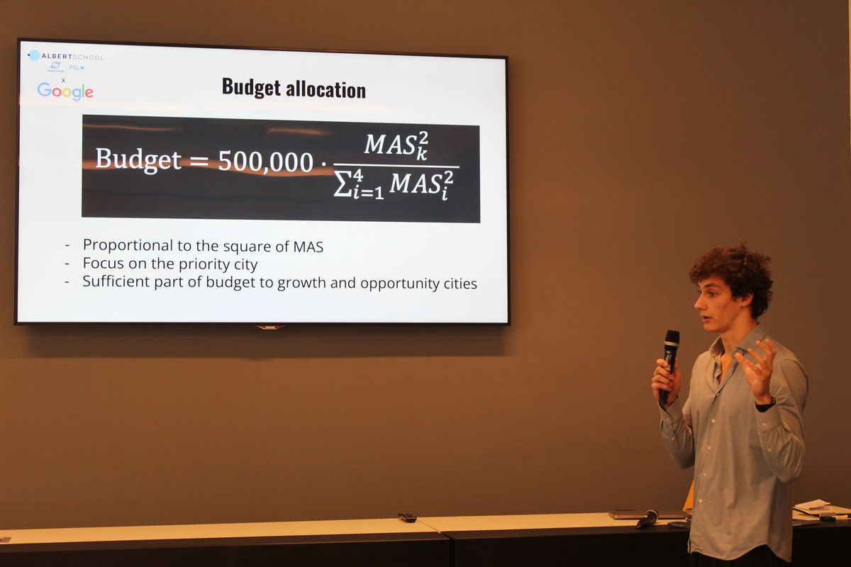 Albert School student presenting his Business Deep Dive for Google, using mathematical and AI models — part of the School of AI hands-on learning approach