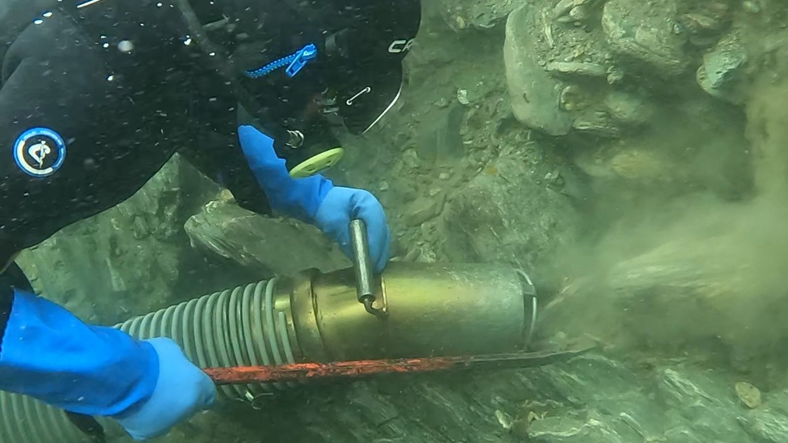 Michael O’Keefe dredging for gold in NZ rivers.