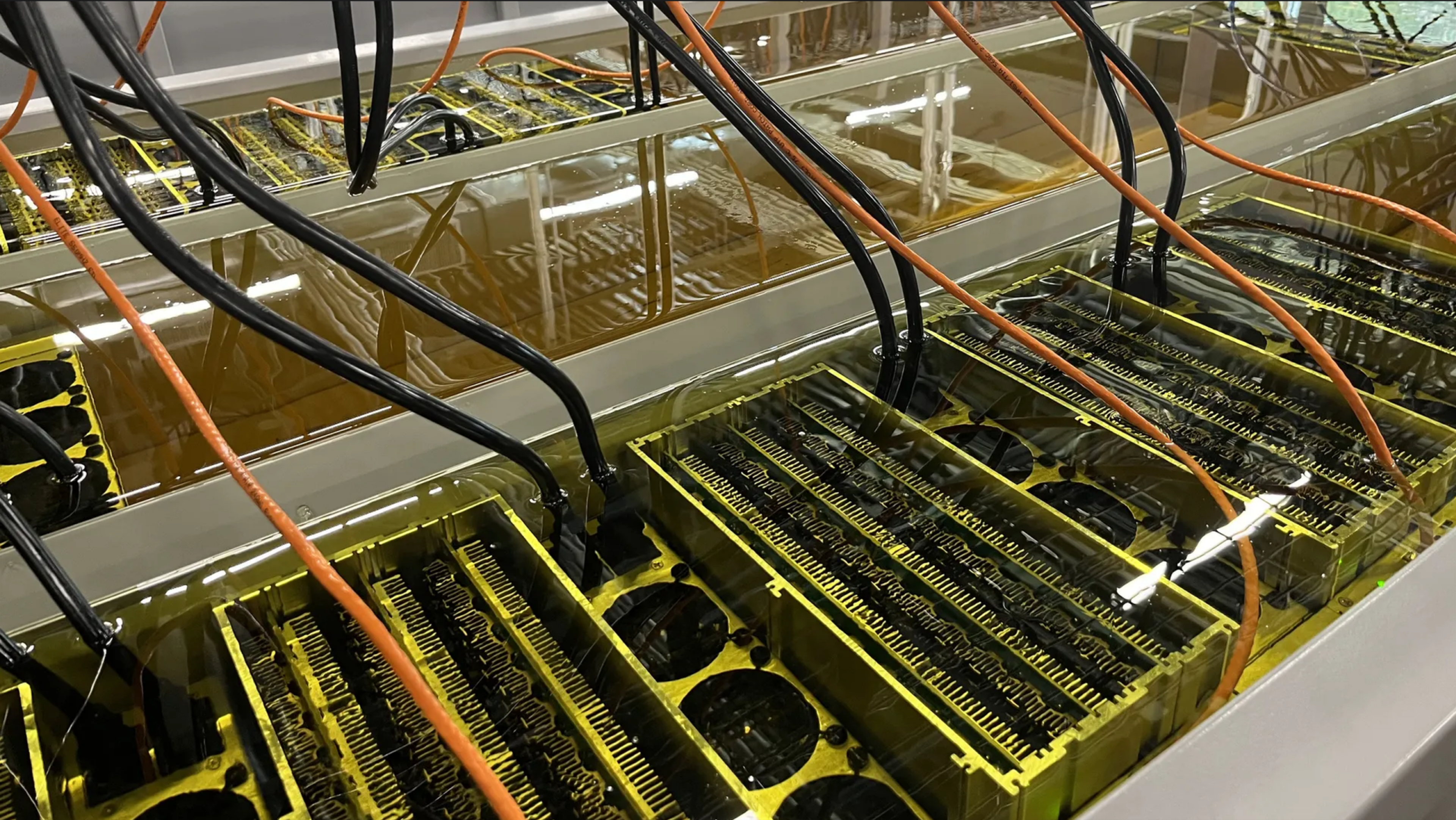 Bitmain Antminer s19j's submerged in water to assist with cooling