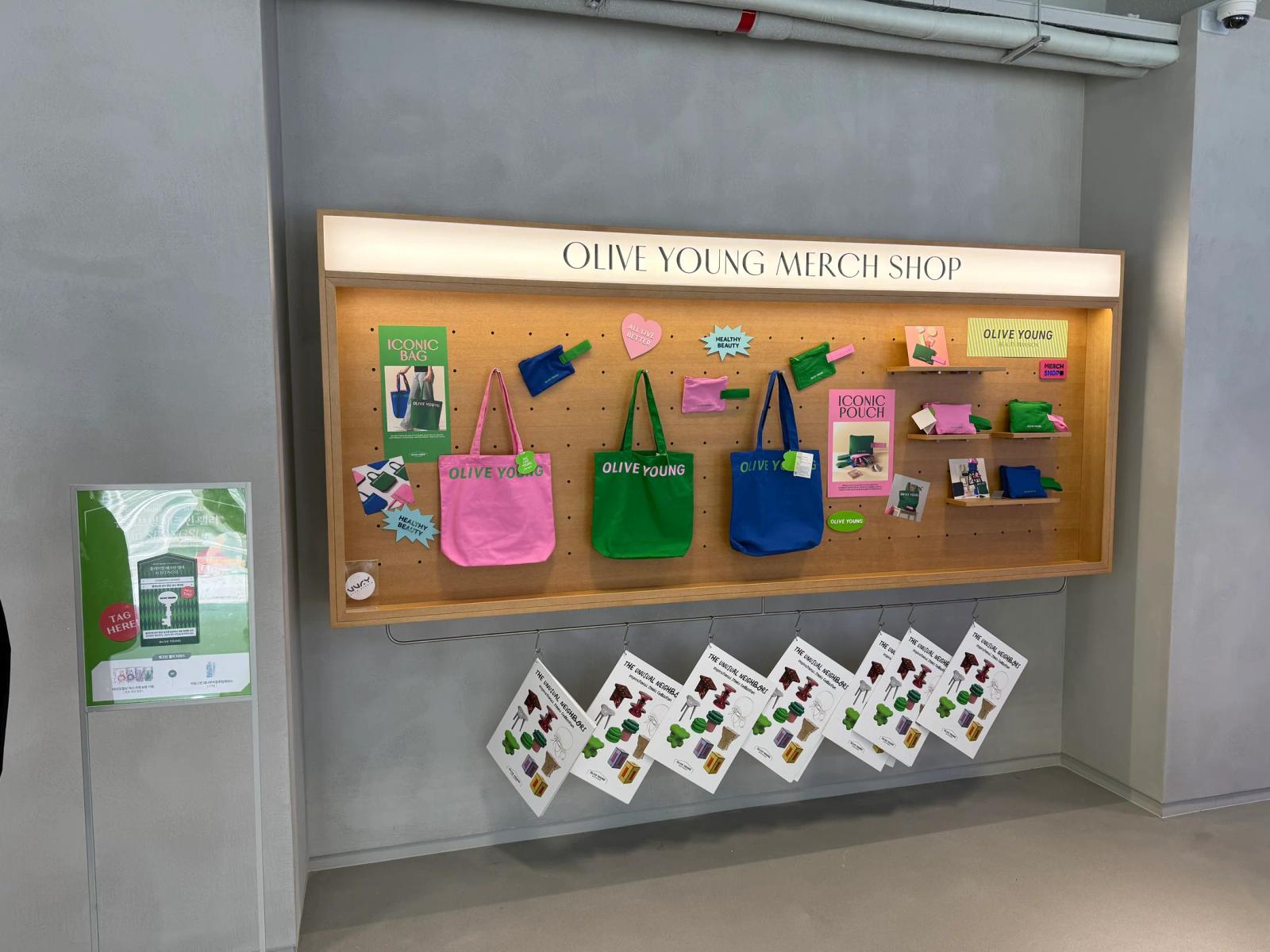 Check-in signage beside the merchandise display