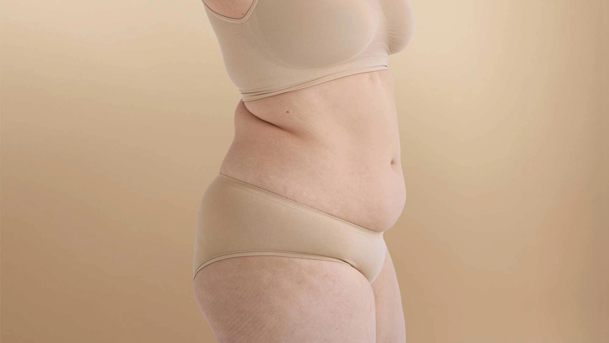 Person with their belly exposed