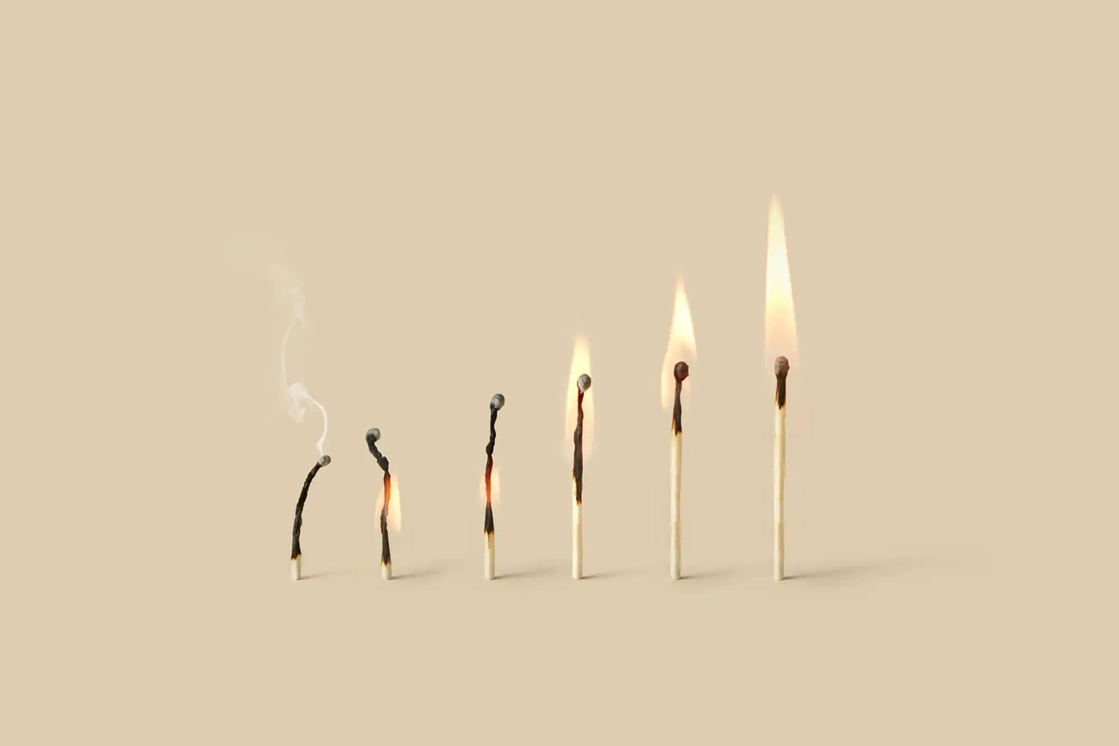flame of burnt out match growing stronger