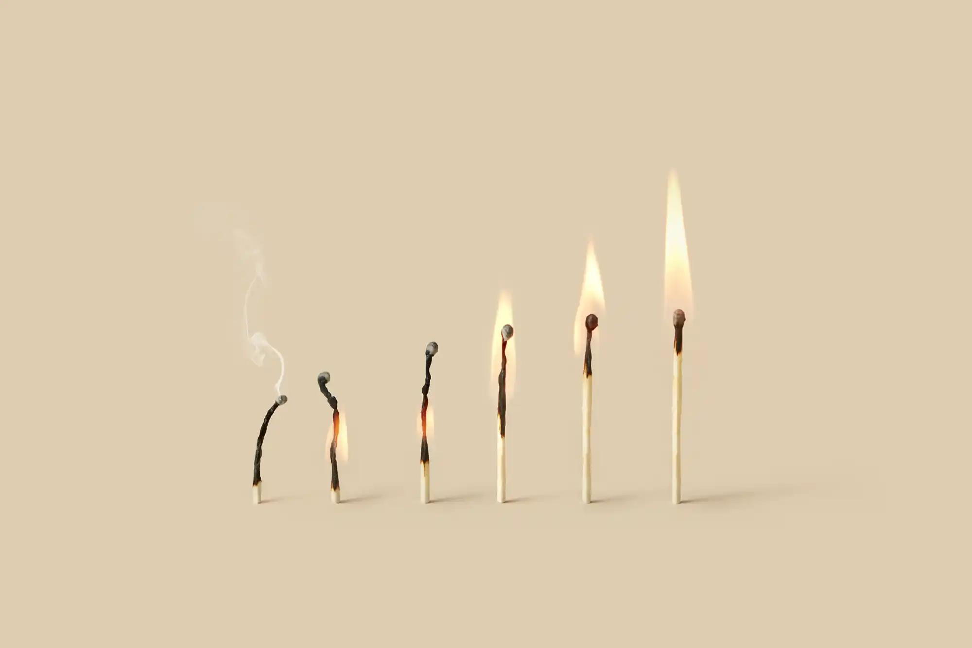 flame of burnt out match growing stronger