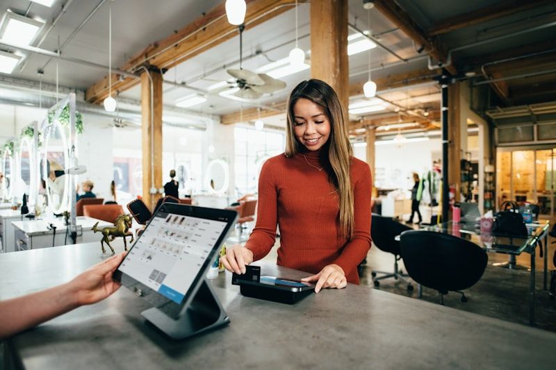 Shop owner serving a customer