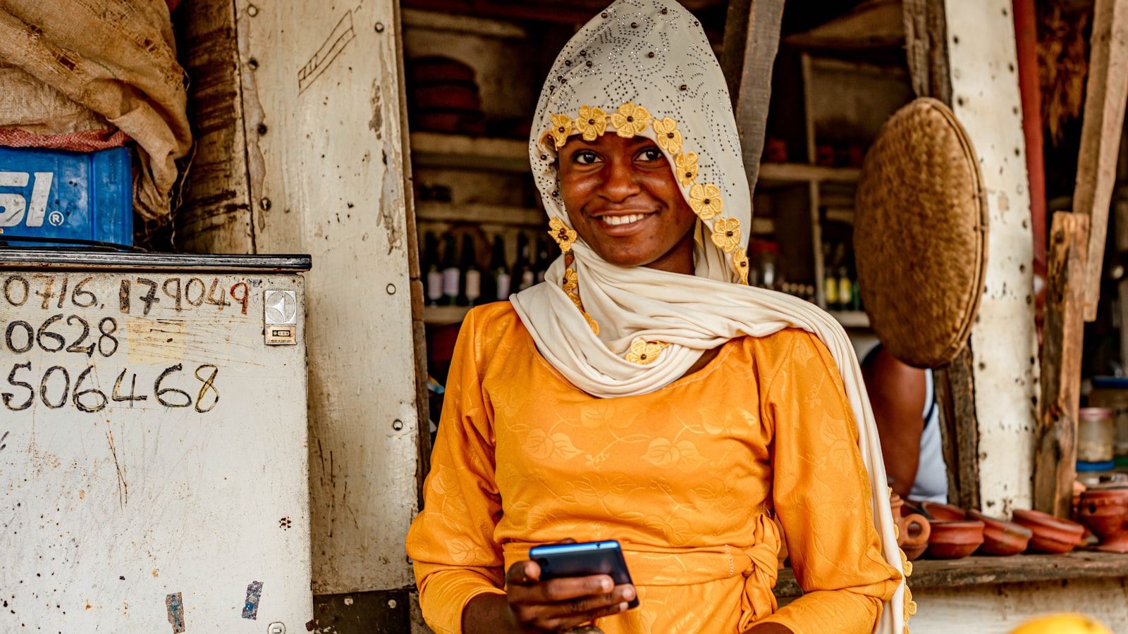 Nigerian business owner running their whole business from a phone
