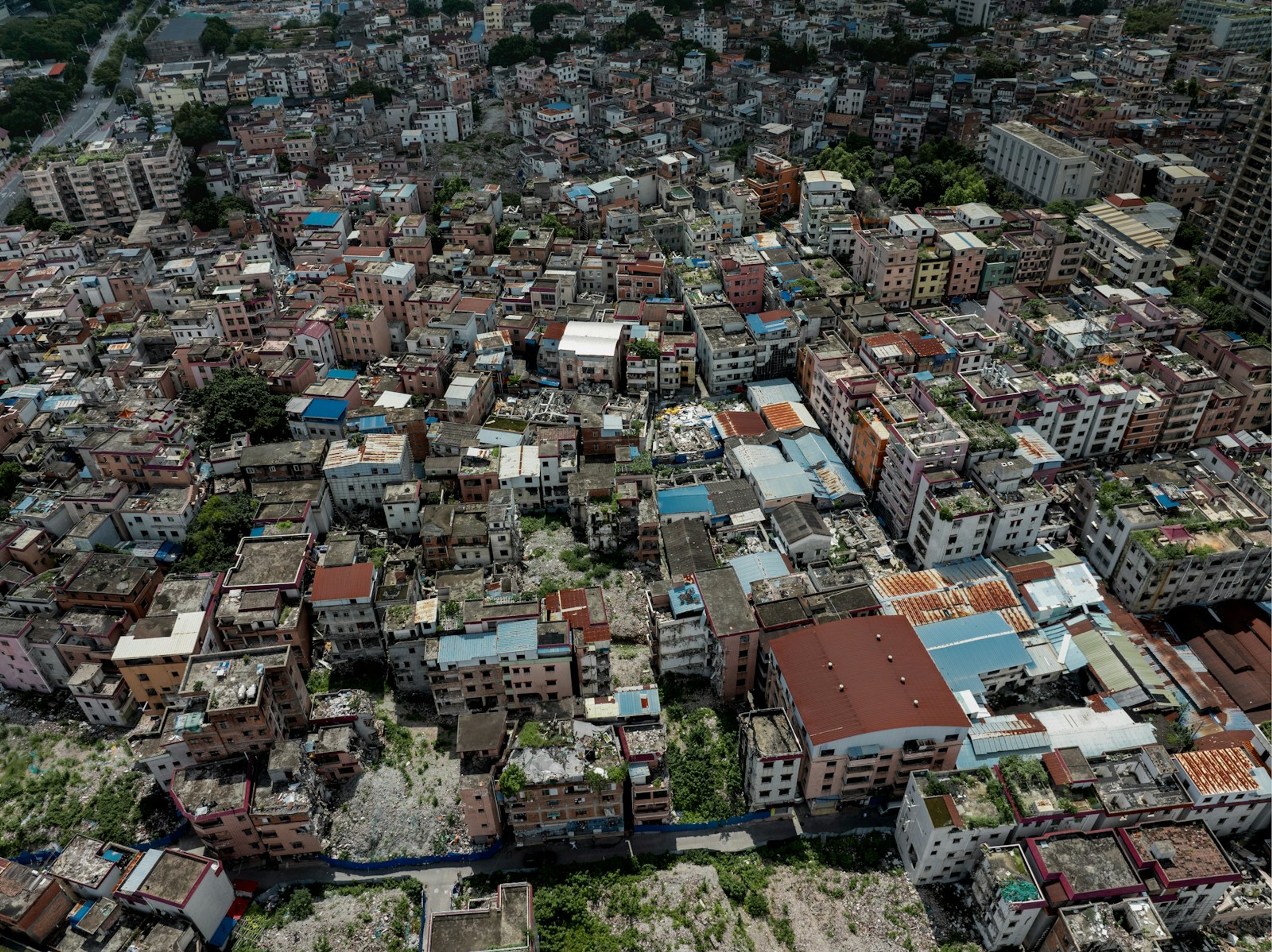 Tightly packed flat roofs of a city quarter from the air