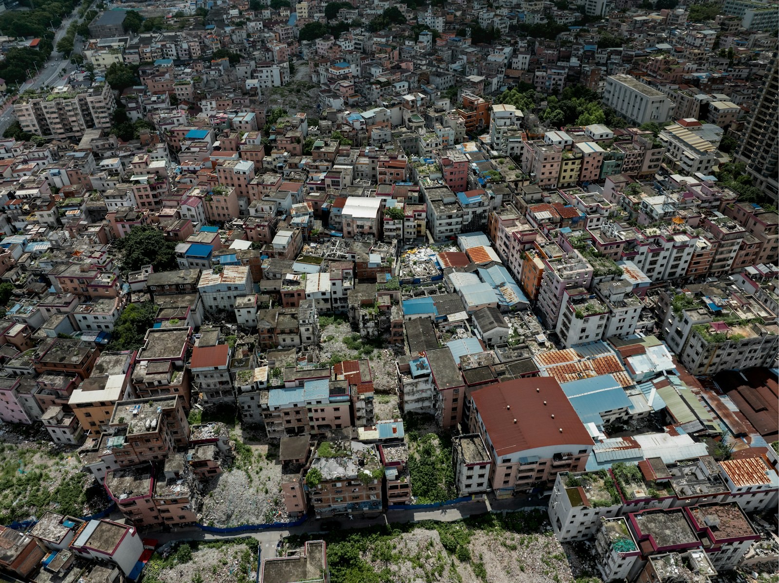 Tightly packed flat roofs of a city quarter from the air