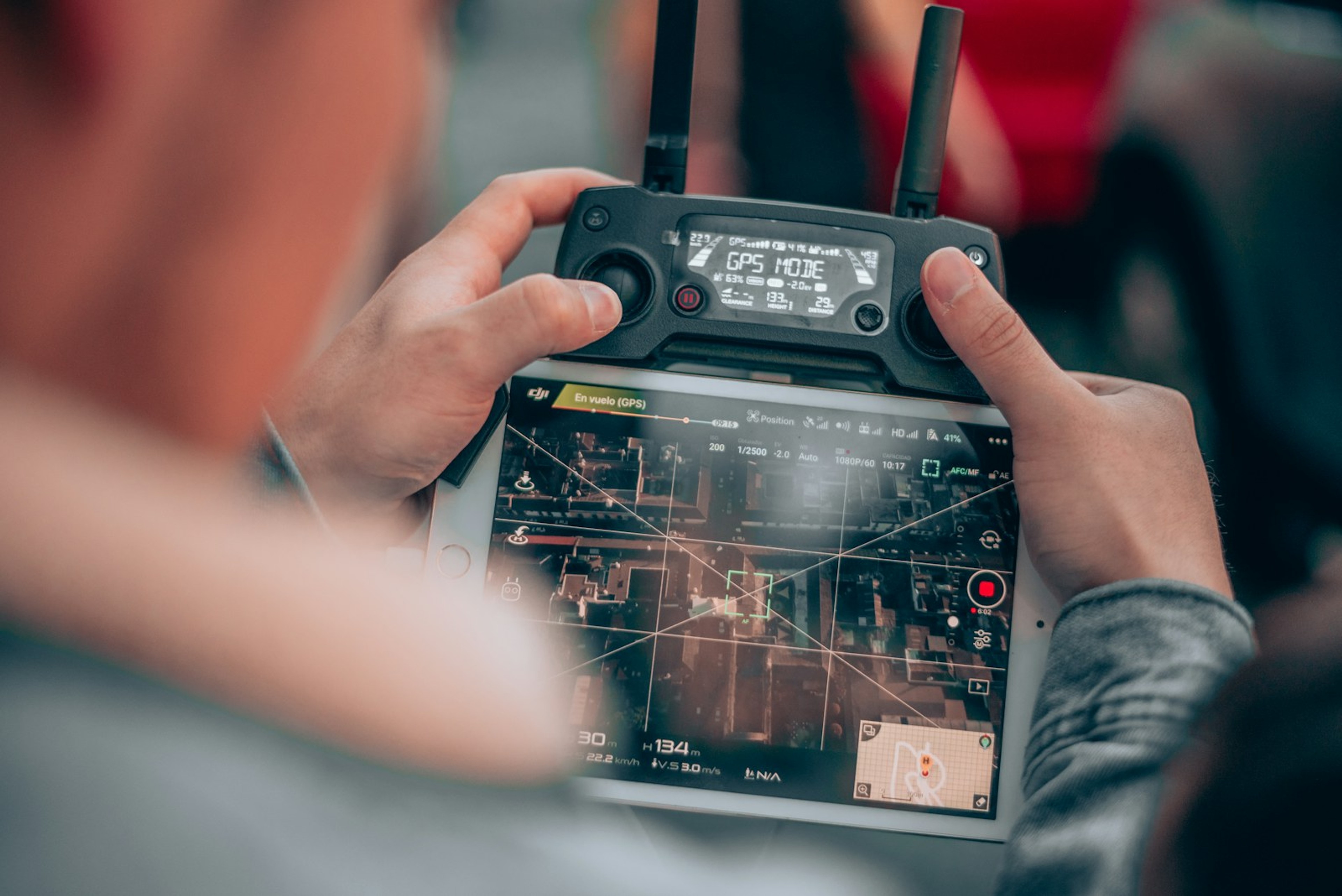 Two people at a controller with a flight planning grid on the display