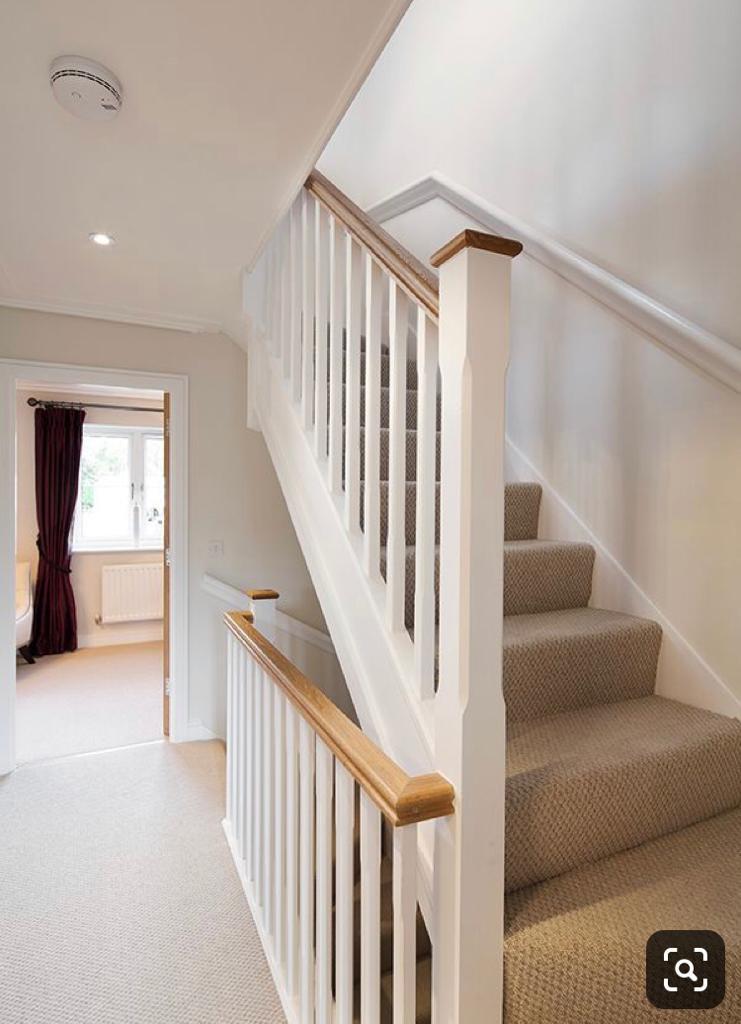 Softwood stairs with Oak hanrail and caps banister