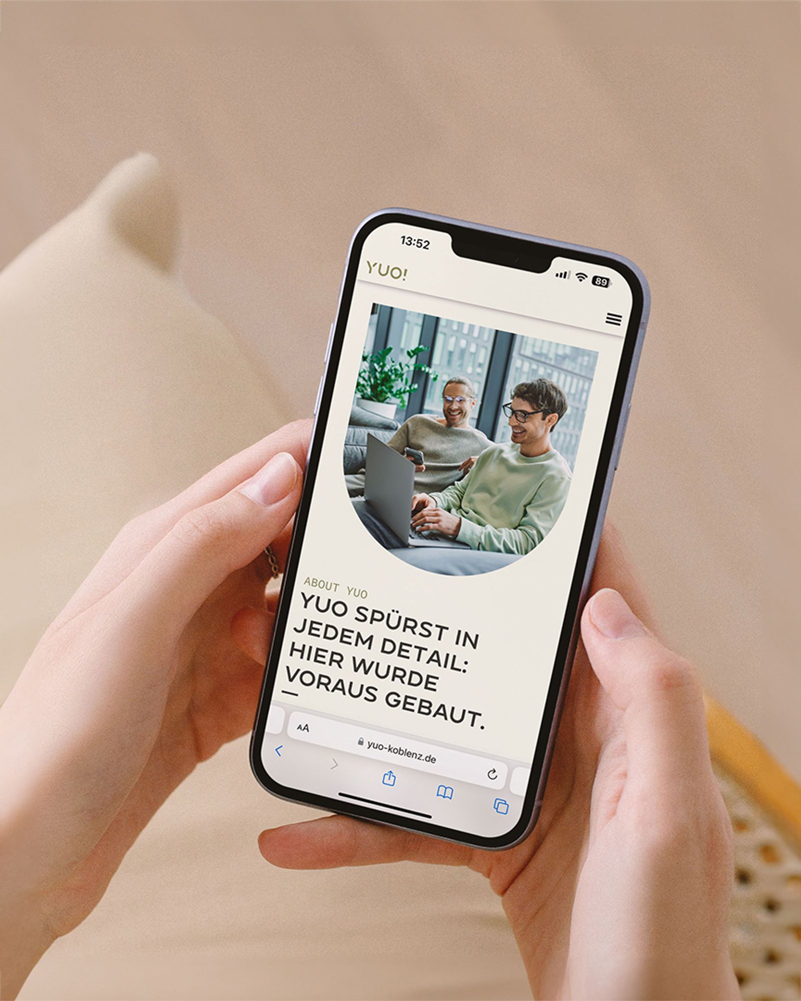 YUO website on a phone with the line “YUO spürst in jedem Detail: hier wurde voraus gebaut.”