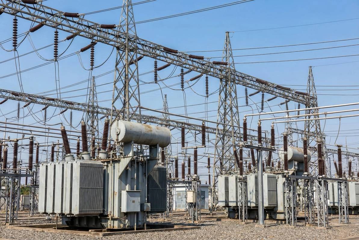 High voltage electric substation with heavy transformers and power grids