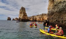 A family kayaking in Arrabida Portugal