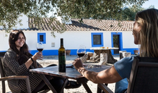 Two ladies sipping wine at rural farm in Alentejo