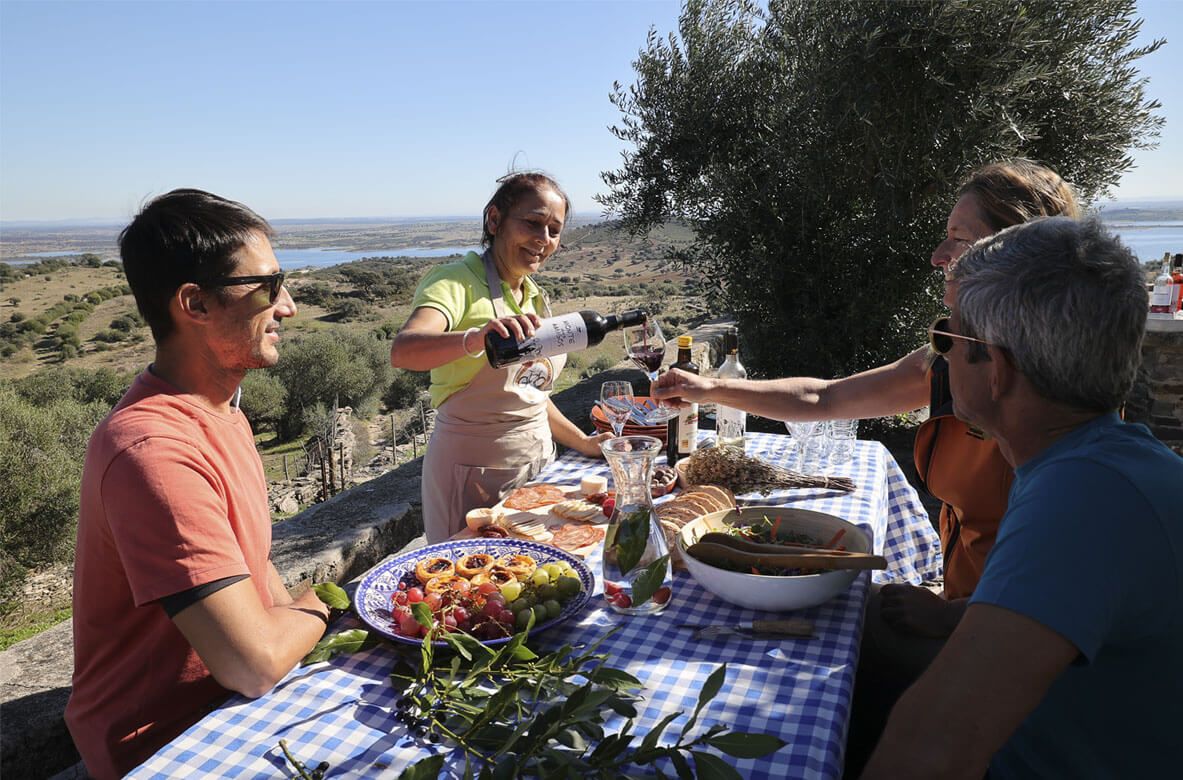 Hikers having picnic at the lake in Alentejo