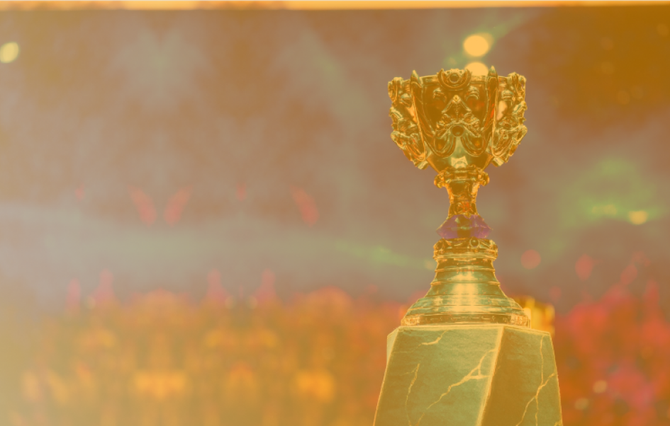 An ornate trophy sitting before a blurred out cheering crowd