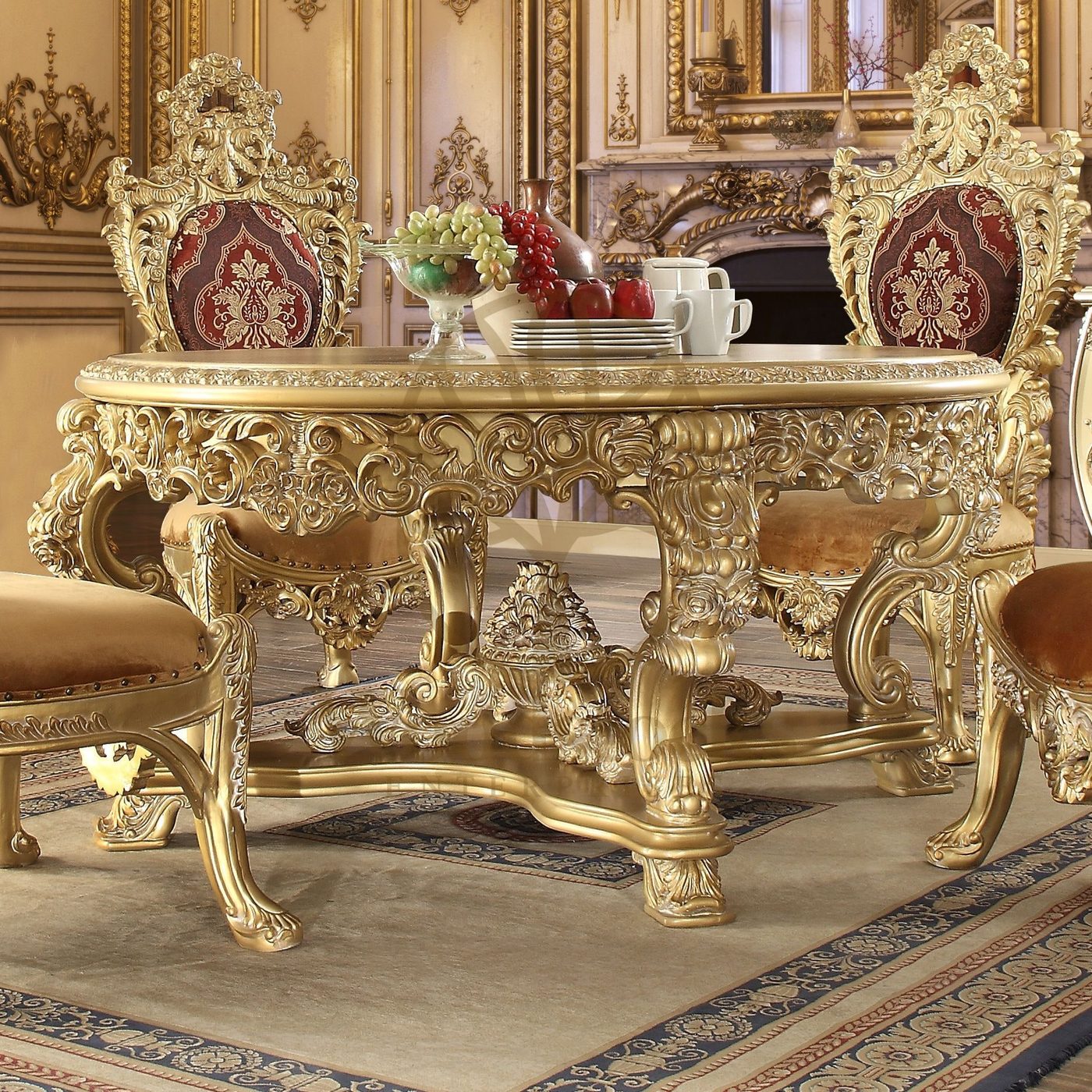 Hand carved royal dining table in teak with a gold-toned antique polish and matching carved chairs