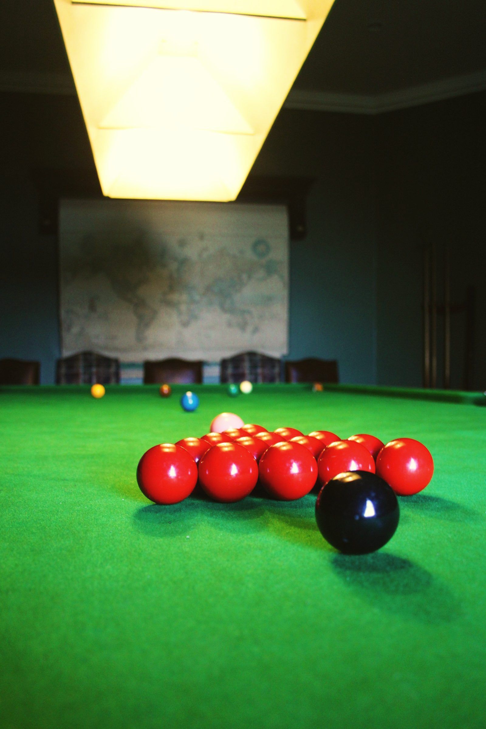 Snooker balls racked on the table in the games lounge