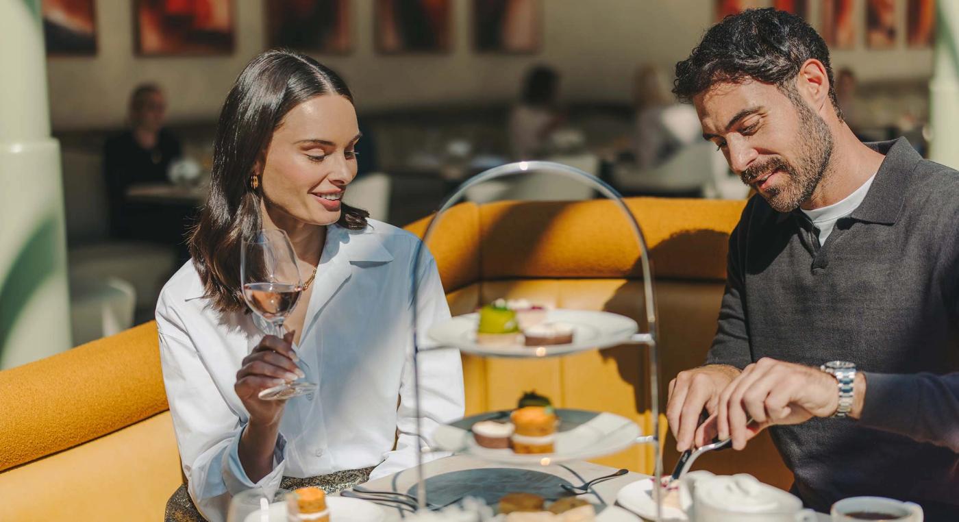 A couple enjoying afternoon tea at The Orangery