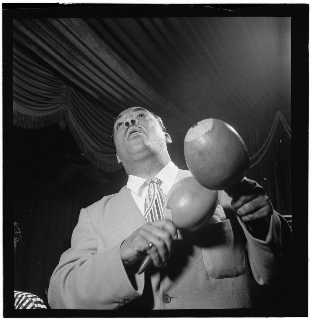 Machito performing on stage with his band at a New York venue in the 1940s