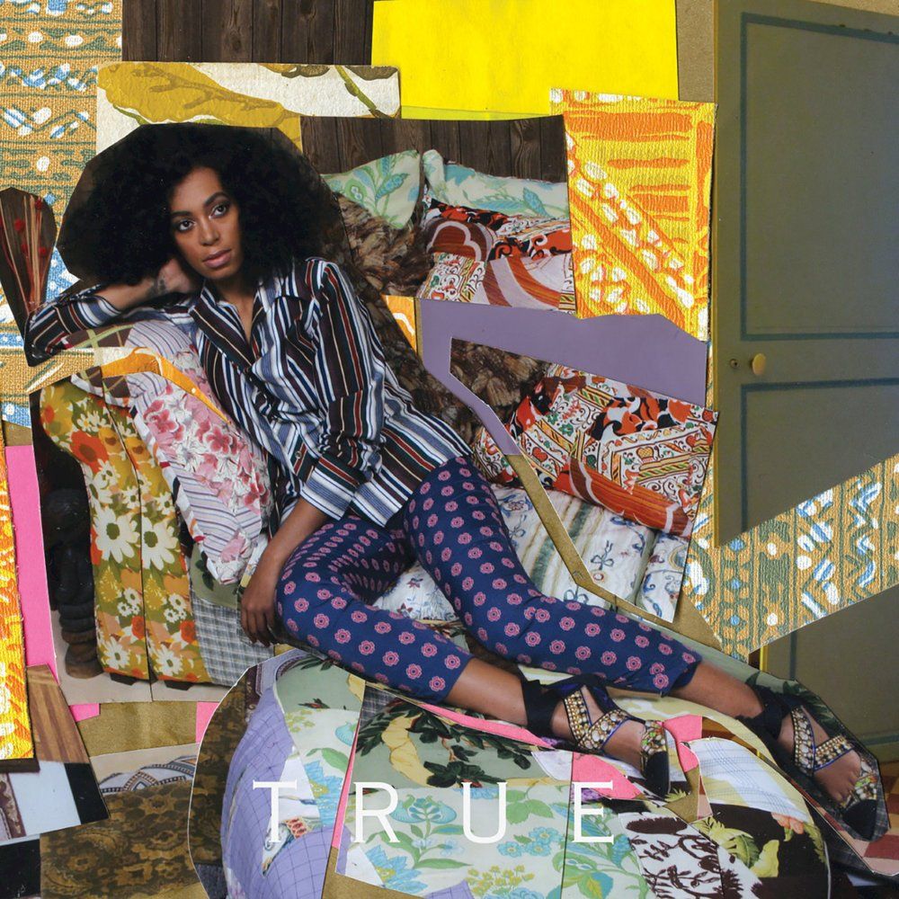 A vibrant, colorful Cubist-style collage featuring a woman reclining.  The woman, with voluminous dark hair, is wearing a striped collared shirt and blue pants with a red floral pattern. She leans back against a surface that is a patchwork of various floral and patterned fabrics. The entire image is constructed like a collage, with jagged, overlapping edges and mismatched sections of wallpaper, patterns, and a green door in the background. At the bottom, the word "TRUE" is written in large, thin white capital letters across the colorful pieces. The overall aesthetic is eclectic, artistic, and heavily textured.