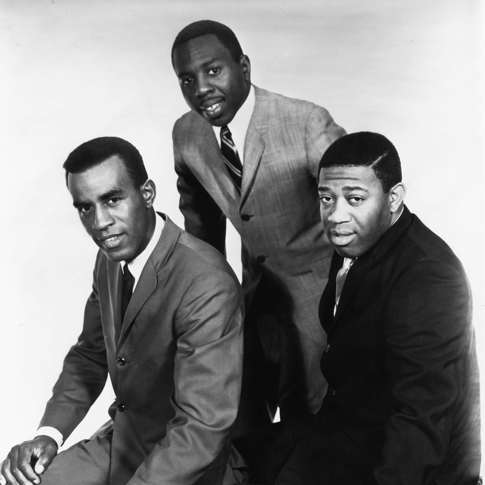 1964 group photo of The Impressions: Sam Gooden, Curtis Mayfield, and Fred Cash