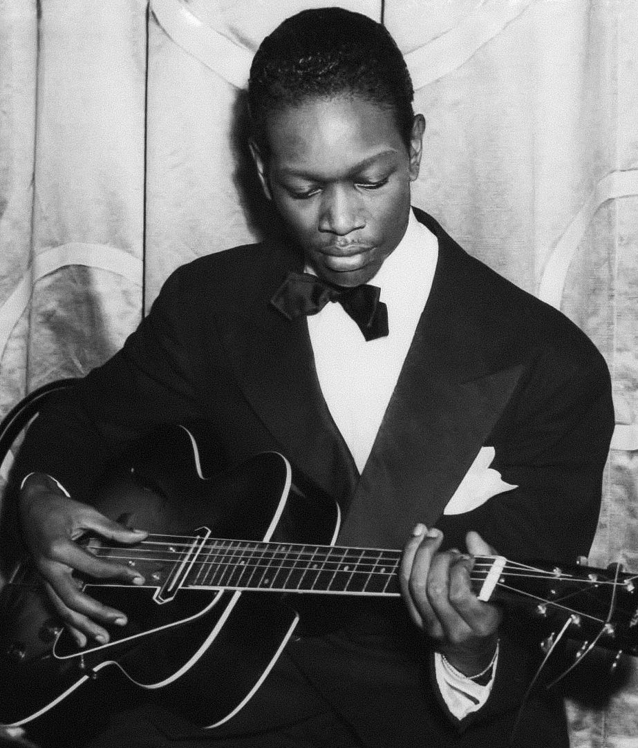 Black and white portrait photo of jazz guitarist Charlie Christian