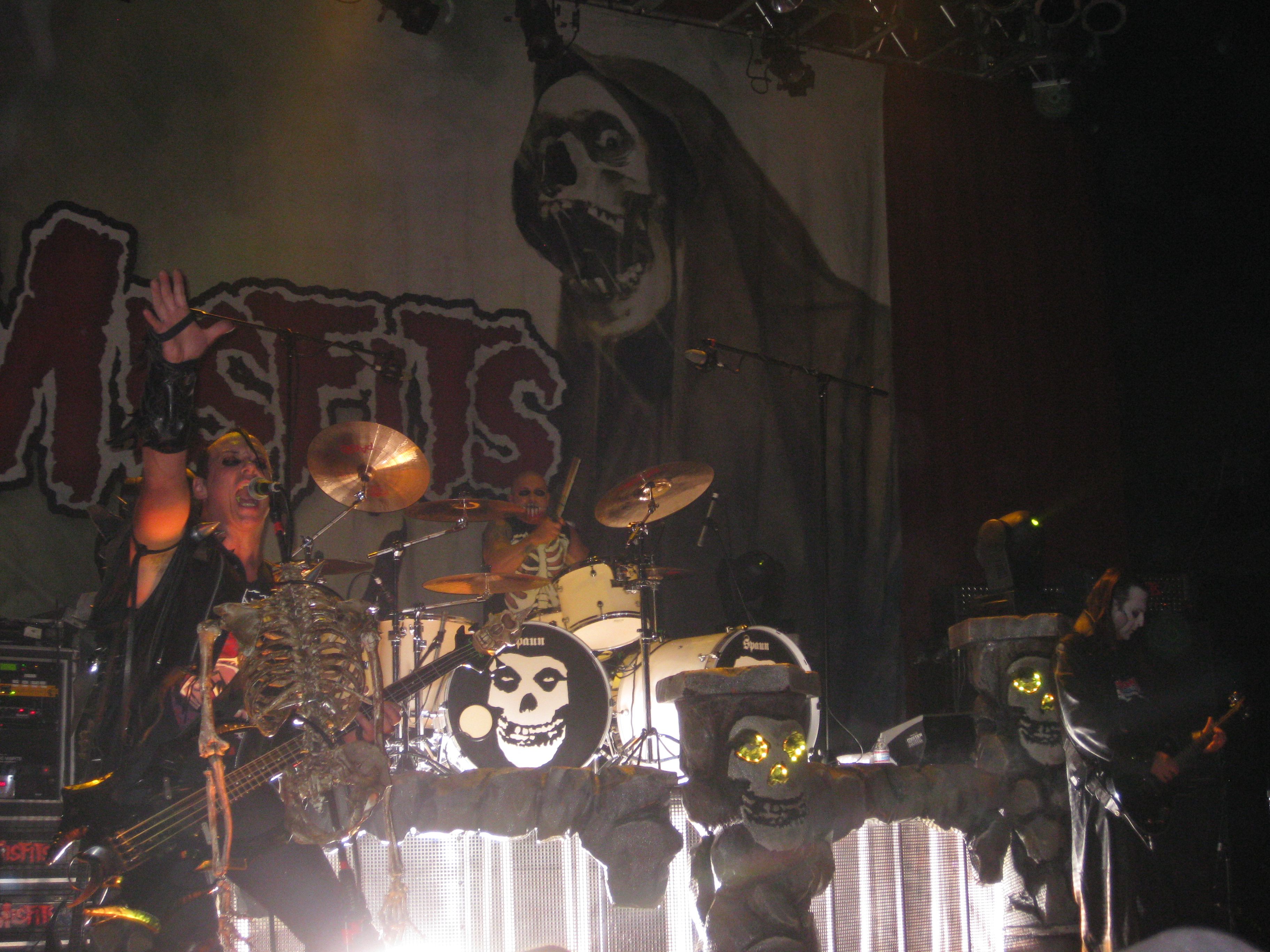 Three members of the punk band Misfits performing live on stage