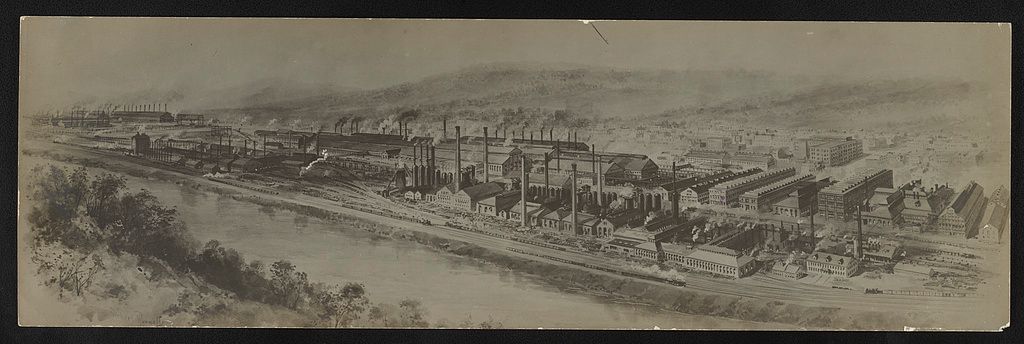 This is a historical, sepia-toned panoramic illustration depicting a sprawling industrial complex, likely a steel mill or large manufacturing plant, situated along a river.