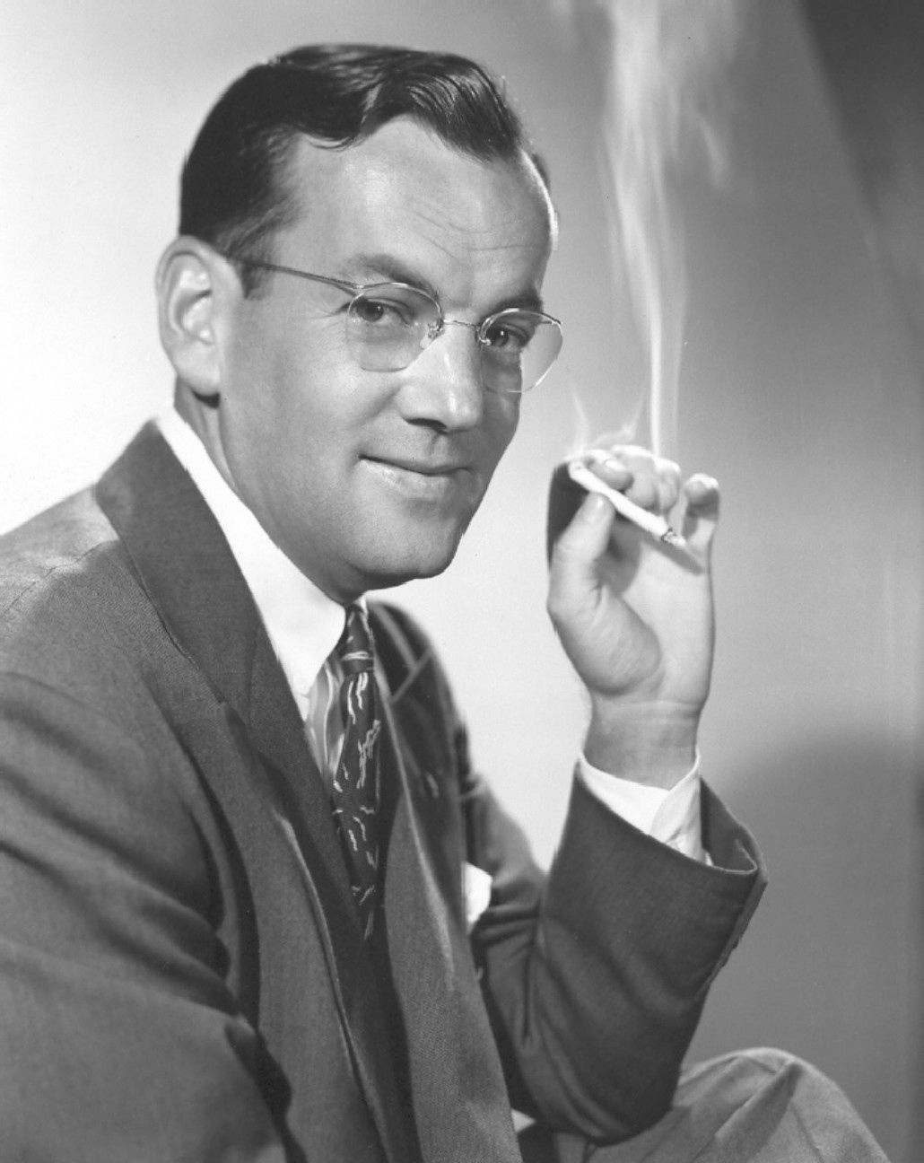 Black and white portrait photo of bandleader Glenn Miller