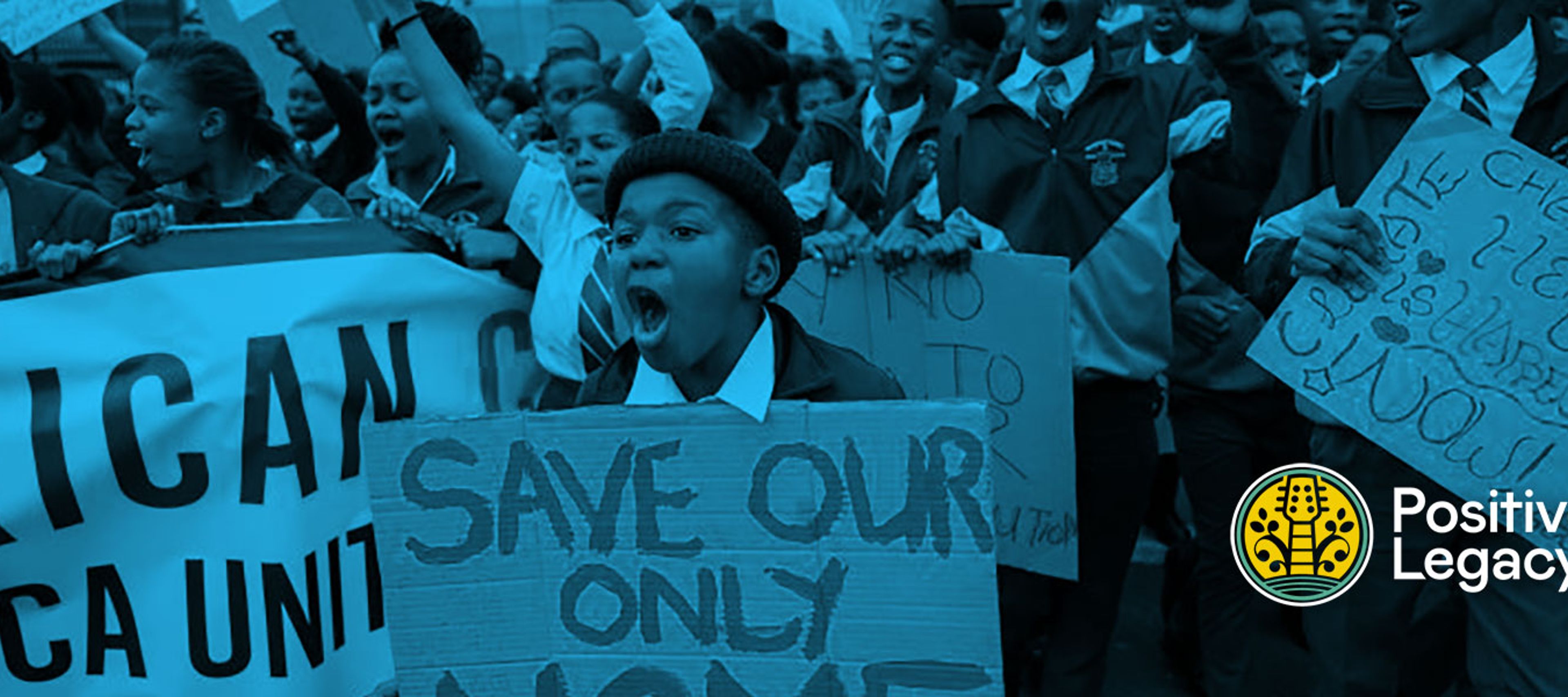 Kids in Africa protesting environmental protections while holdings signs