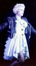 Madonna performing on stage at Wembley Stadium in 1987