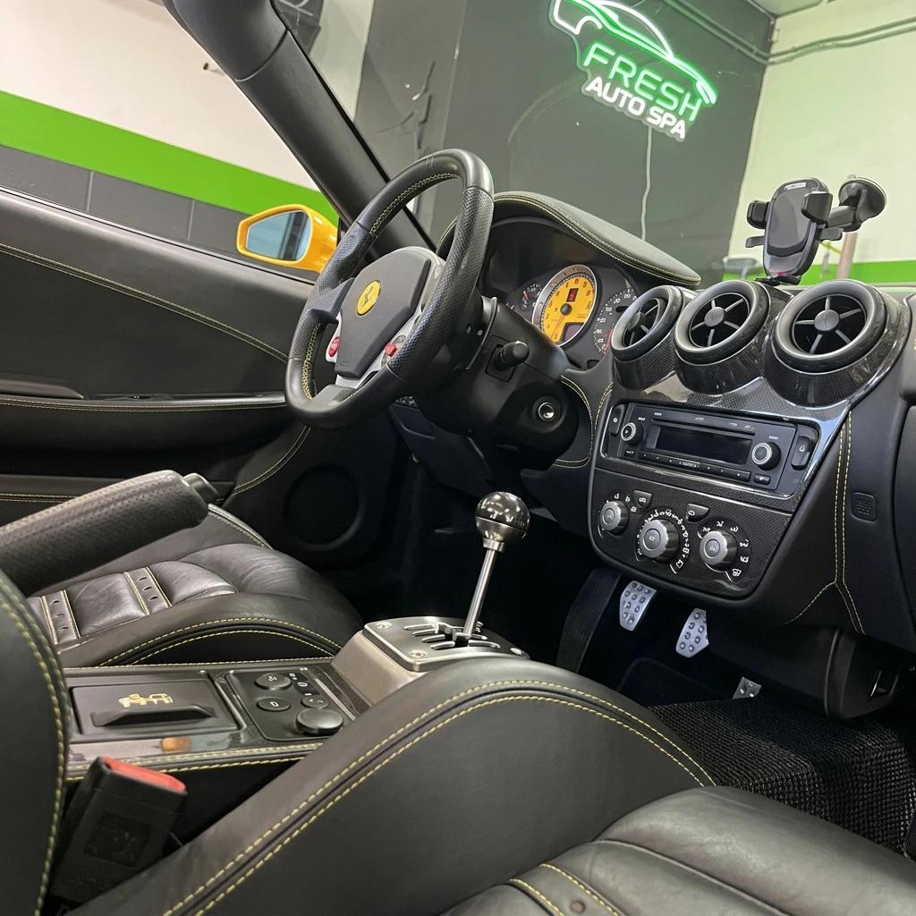 Interior Detailing Black Sports Car — professional auto detailing work completed at Fresh Auto Spa in Port Chester, NY