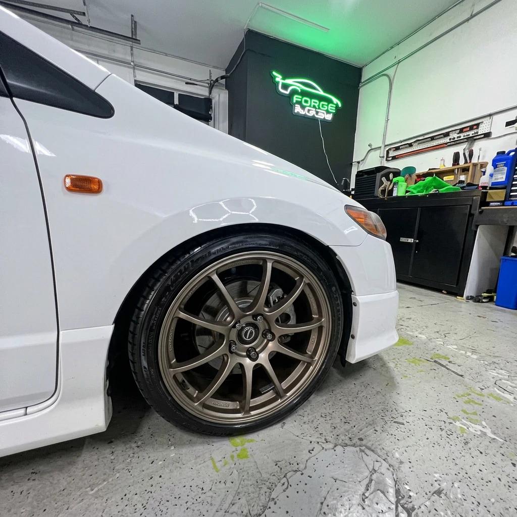 Wheel Detailing White Coupe — professional auto detailing work completed at Fresh Auto Spa in Port Chester, NY