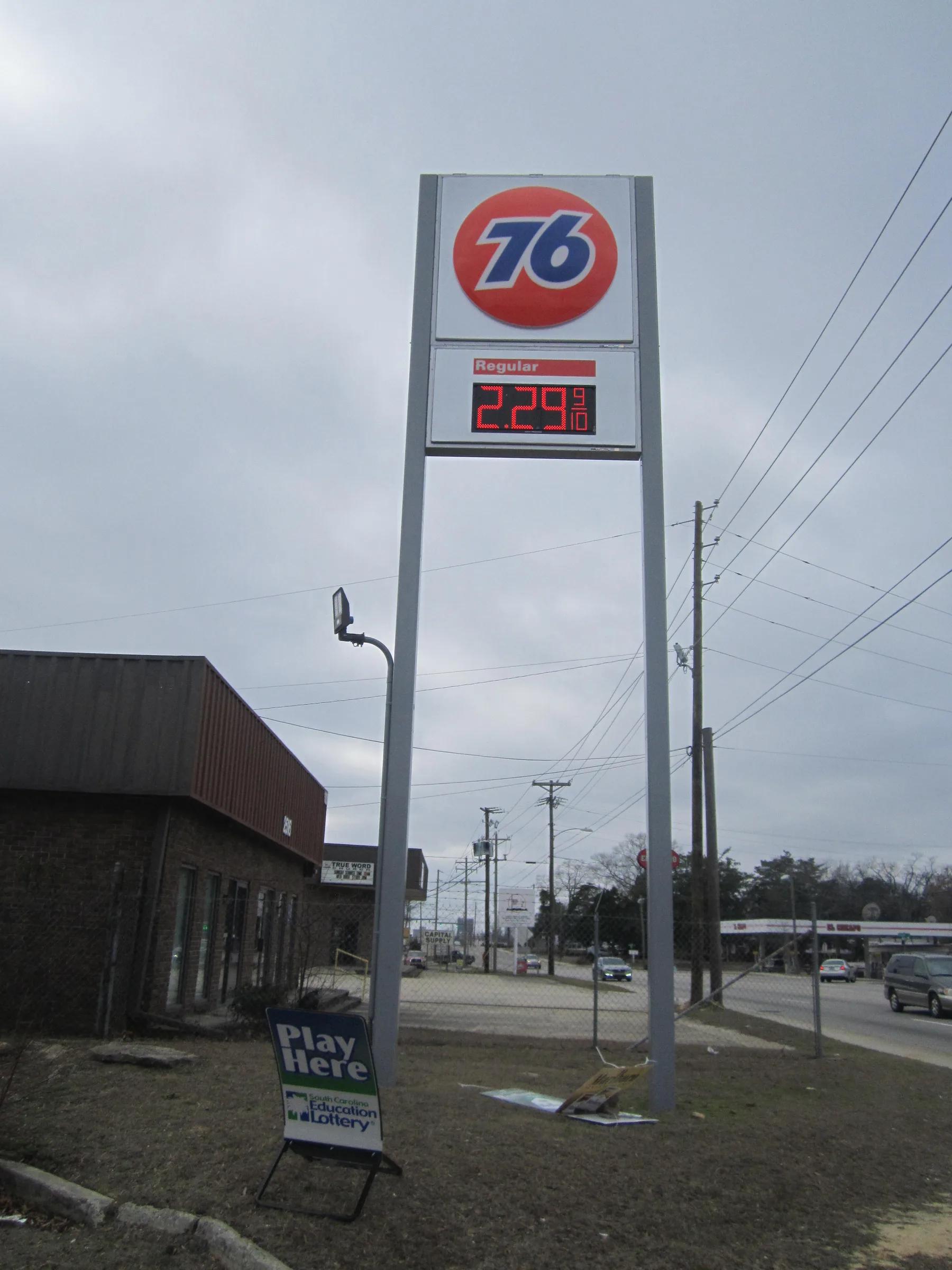 76 pylon price sign with a red LED price numeral at the roadside