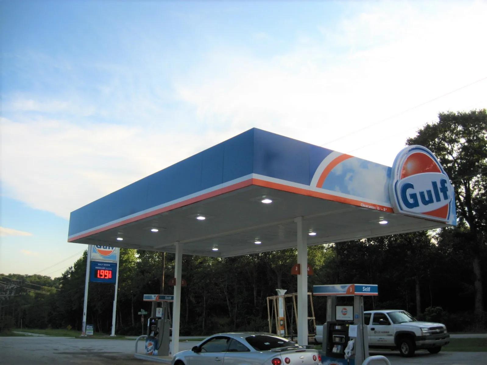 Gulf canopy with a blue fascia and an orange Gulf sign, a price sign behind