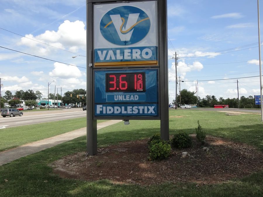 Valero monument price sign with an LED price, on a landscaped base