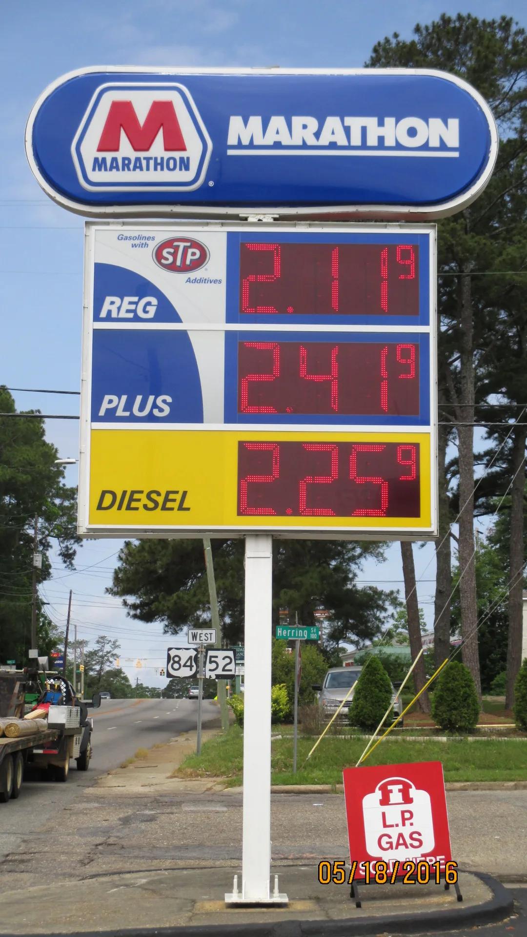Marathon pylon price sign with red LED price numerals for regular, plus and diesel