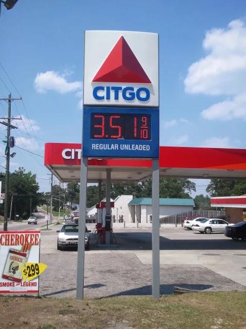 Citgo pylon price sign with an LED price for regular unleaded, a Citgo canopy behind