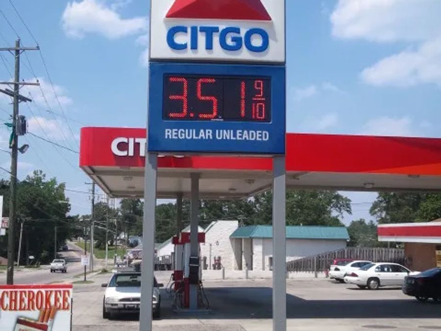 Citgo pylon price sign with an LED price for regular unleaded, a Citgo canopy behind