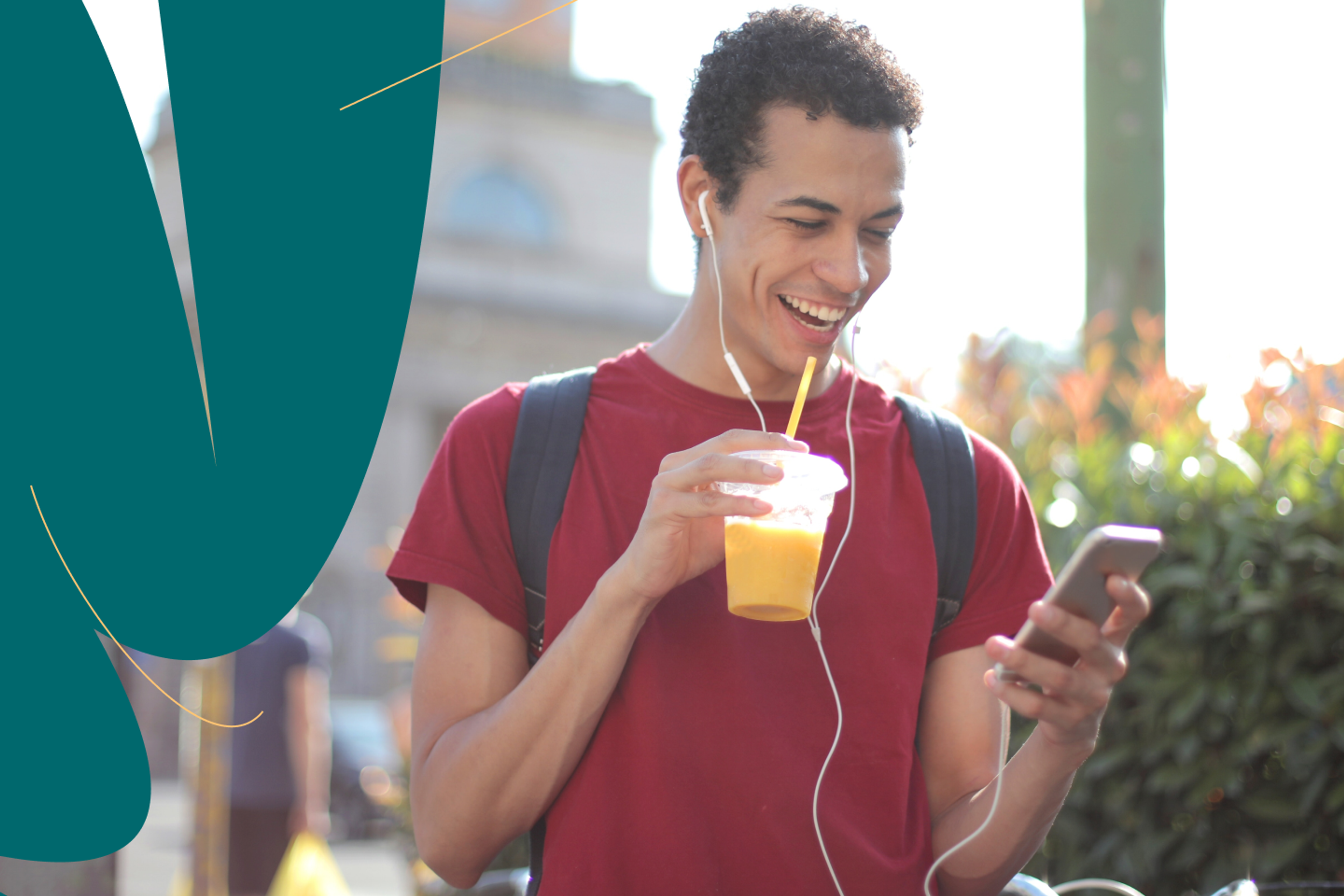 Student on mobile phone holding a drink