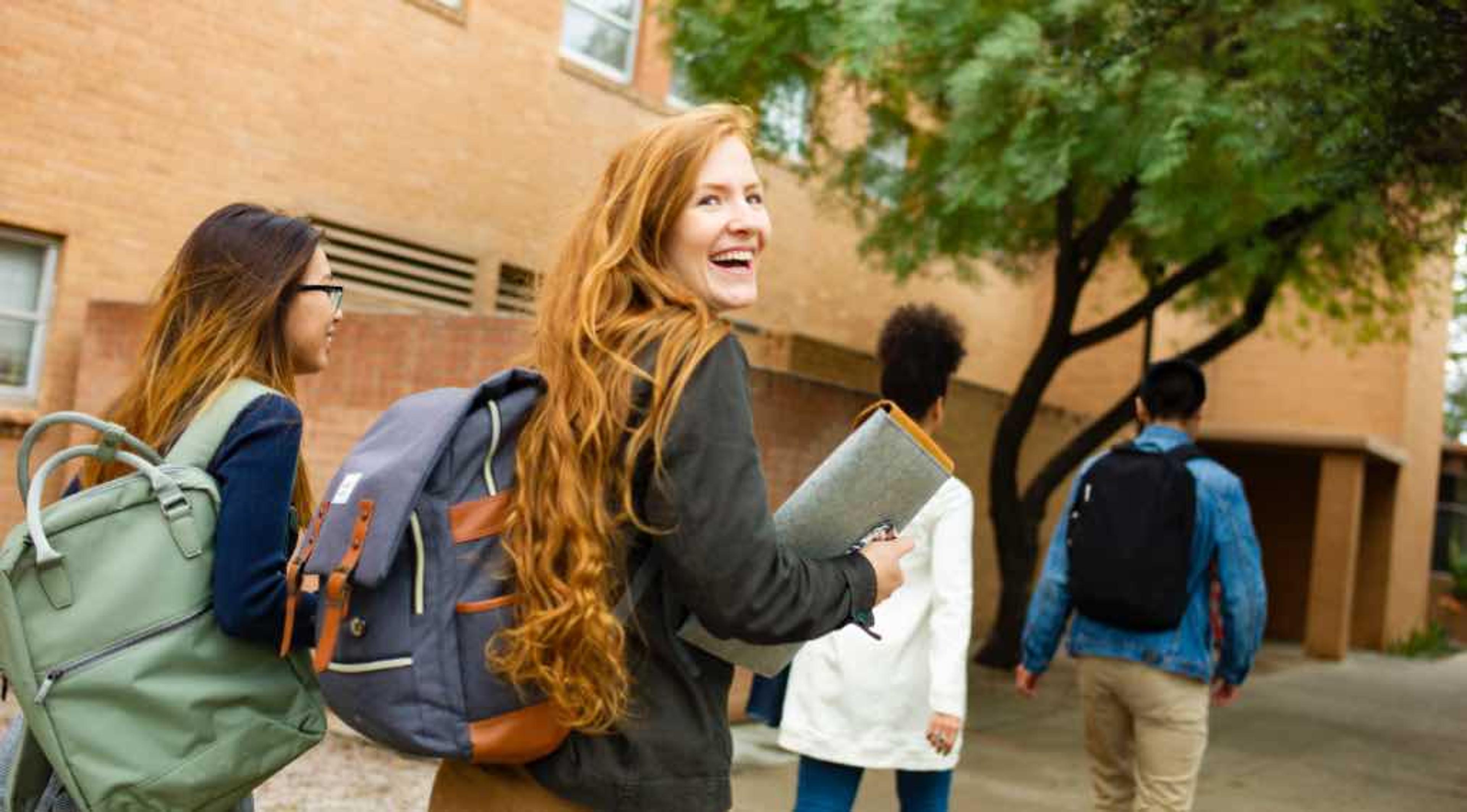 Women walking and smiling