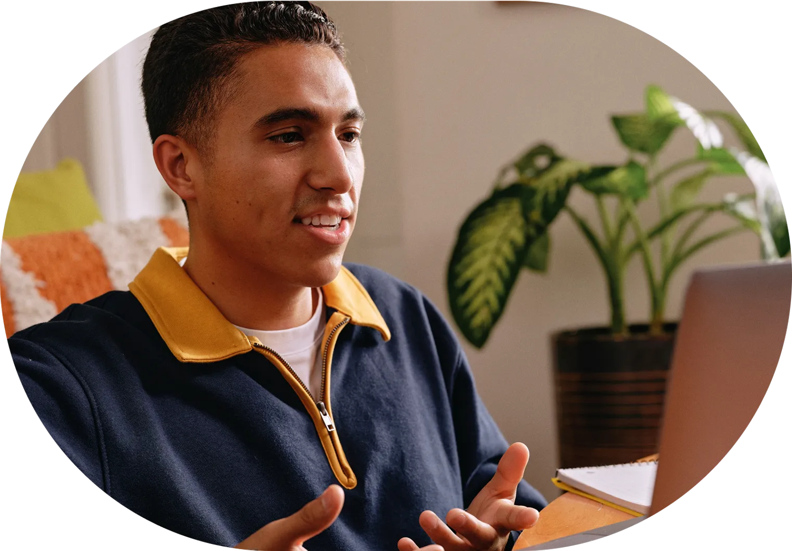Student talking on a video call on a laptop