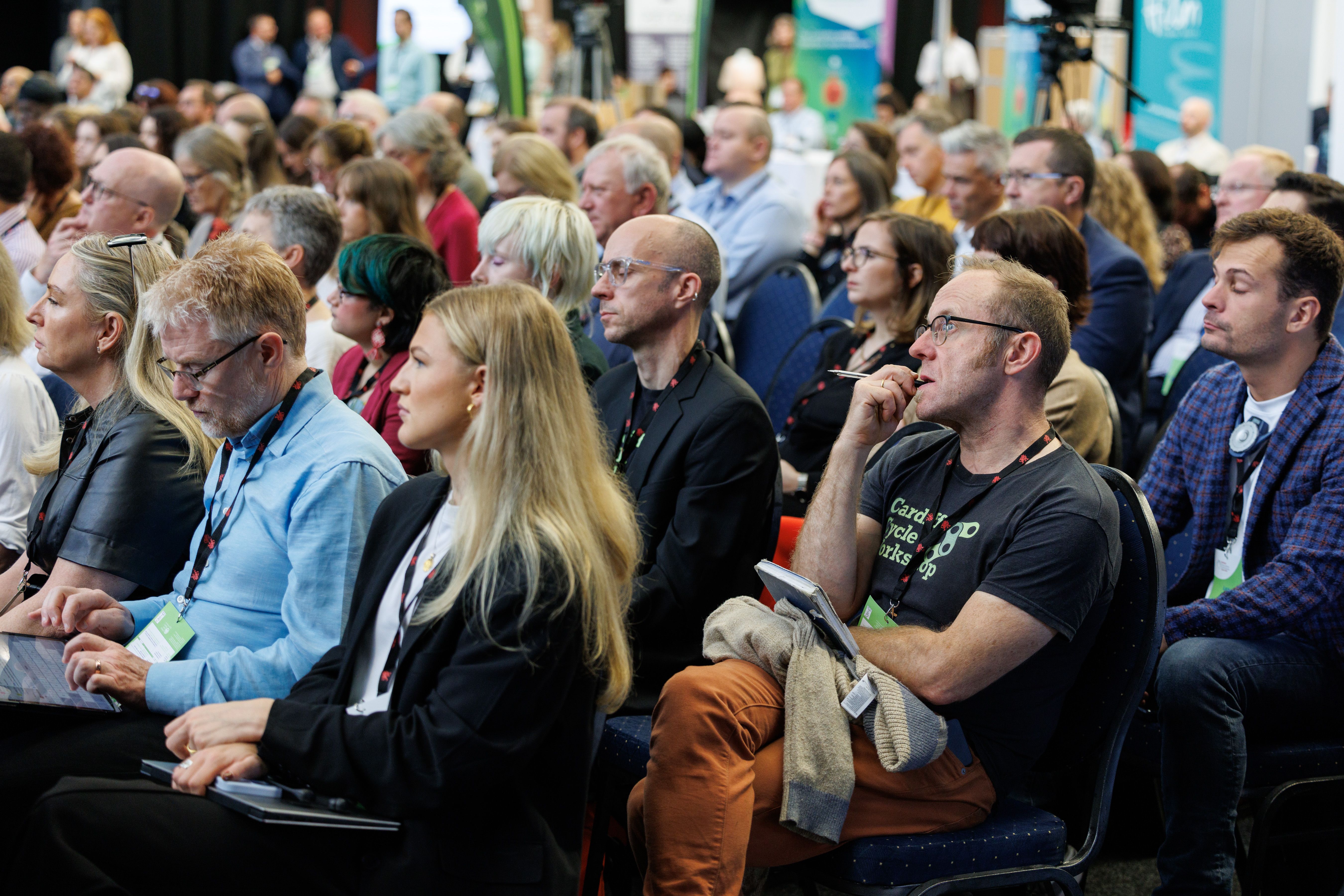 Delegates listen to the proceedings.